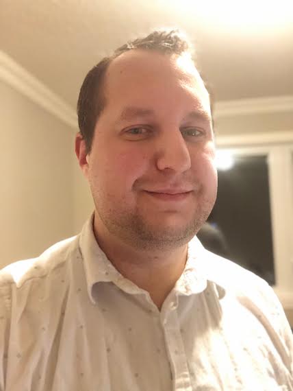 Photo of Aaron smiling