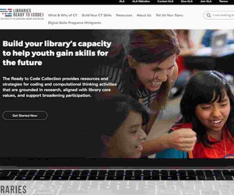 The ALA Ready to Code site on a personal computer screen with library bookshelves in the background
